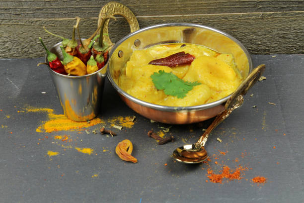 istock Kadhi, dumplings with yogurt sauce curry. 947498684