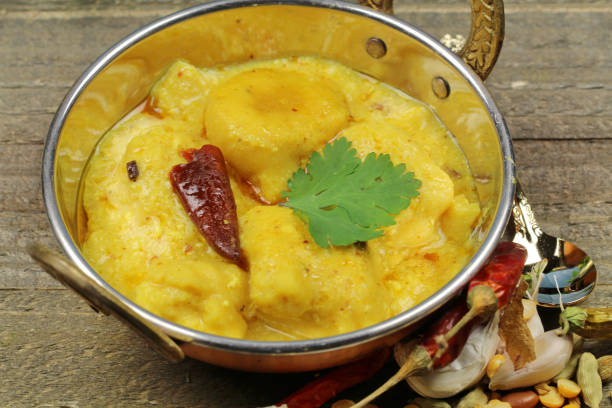istock Kadhi, dumplings with yogurt sauce curry. 947499110