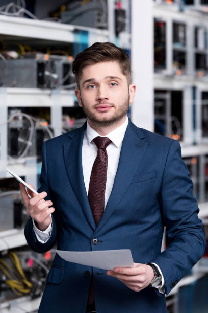 istock successful young businessman at cryptocurrency mining farm 947504442