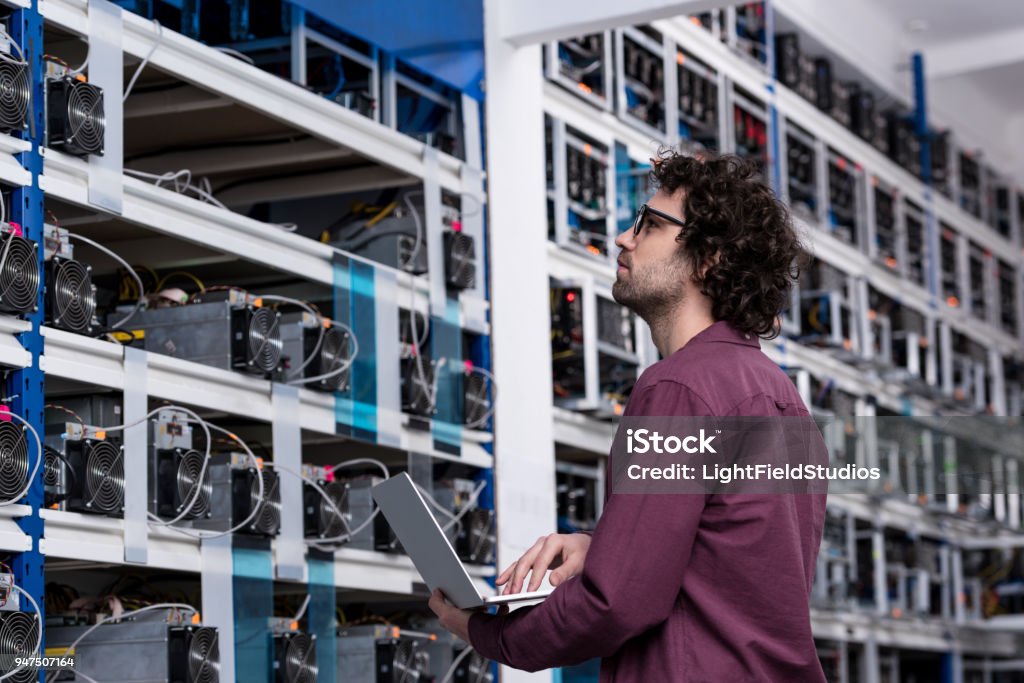 Computer Work Kryptonite Computer Engineer Working With Laptop At Cryptocurrency Mining Farm ...