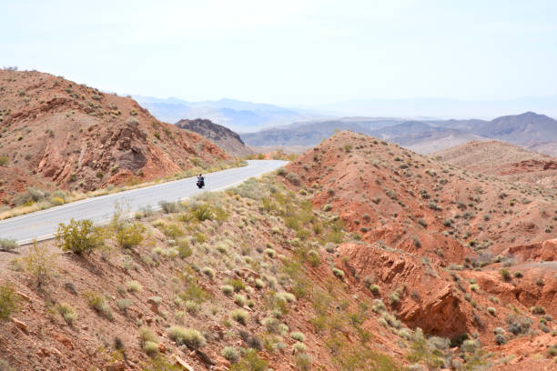 istock Valley of Fire State Park biker on two lane road 947507568