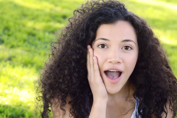 istock Young latin woman with surprised facial expression. 947507658