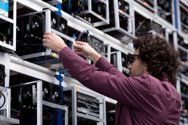 istock computer engineer taking out box with graphic card at ethereum mining farm 947508582