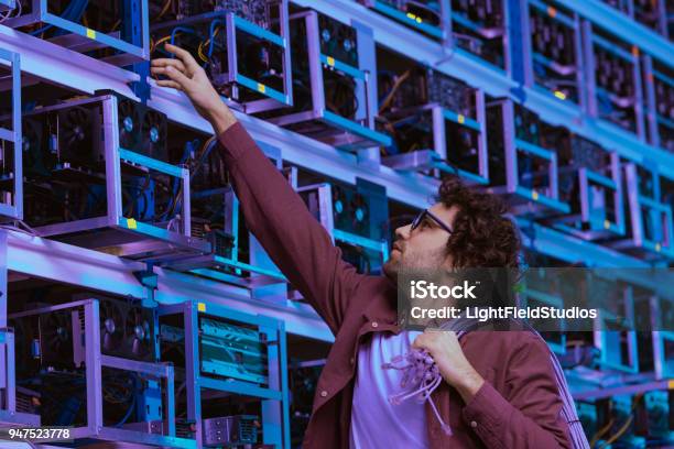 Young Computer Engineer Working At Ethereum Mining Farm Stock Photo - Download Image Now