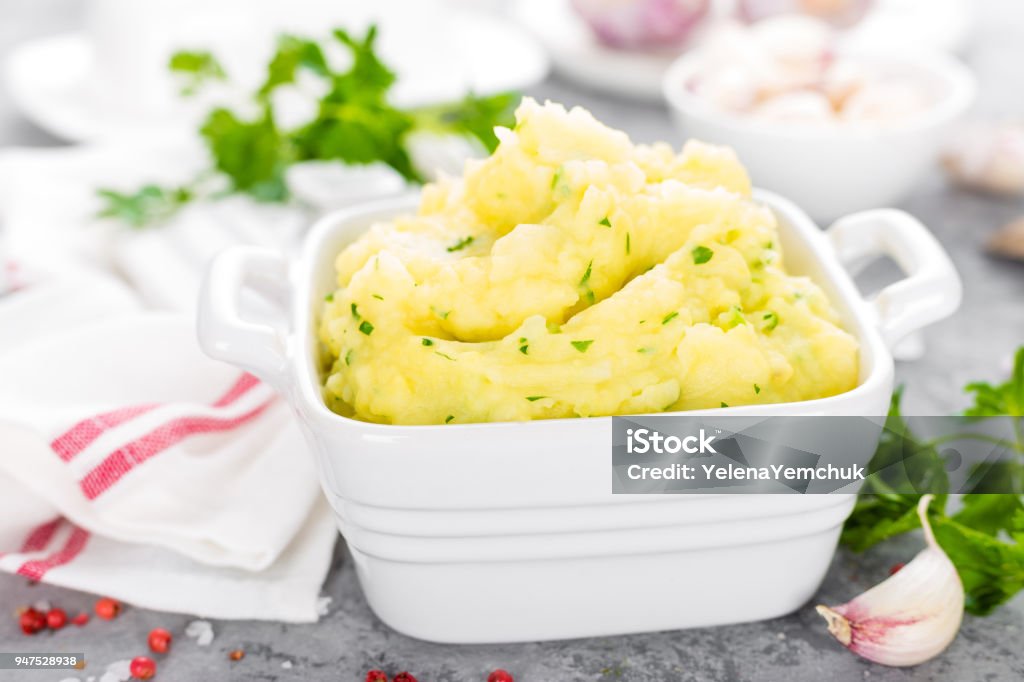 Mashed potato. Potato mash with garlic and parsley. Boiled potato. Potato puree Mashed Potatoes Stock Photo