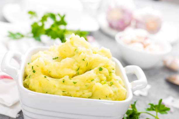 istock Mashed potato. Potato mash with garlic and parsley. Boiled potato. Potato puree 947532068
