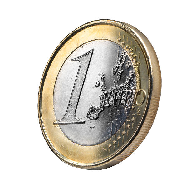 Euro coin isolated Close up Euro coin view against white background. Clipping path. Original texture with a soft treatment to give up an ancient or jewelry presence. european union coin photos stock pictures, royalty-free photos & images