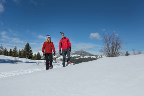 istock Snowshoeing Couple 947549038