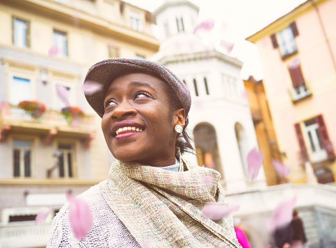 African young woman in old Italian town Acqui Terme