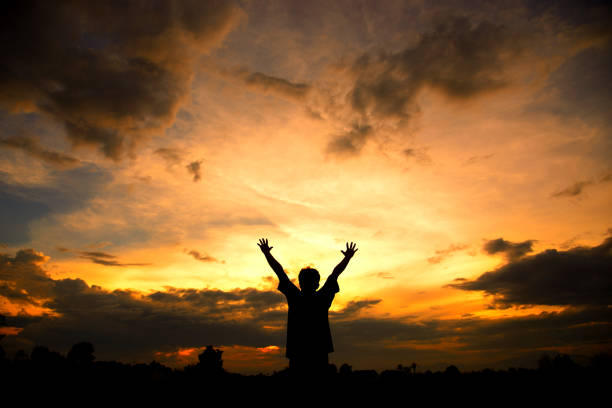 istock Silhouette of human Raise two arms. 947561240