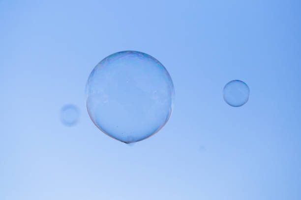 istock A soap bubble floats across a clear blue sky 947583752