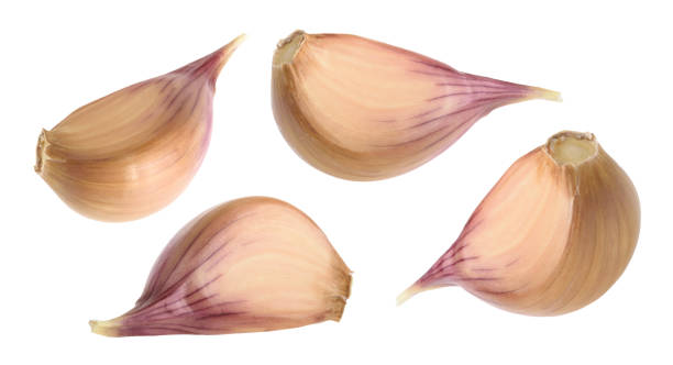 istock Garlic cloves isolated on white background. set 947596326