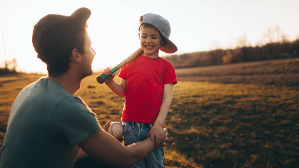 istock Father and son getting ready for a game of baseball 947600368