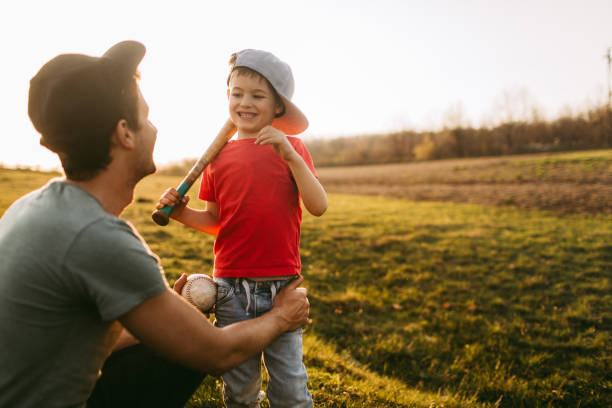 Father and son getting ready for a game of baseball