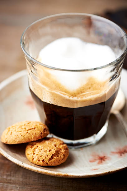 istock Glass of latte coffee with biscotti 947600474