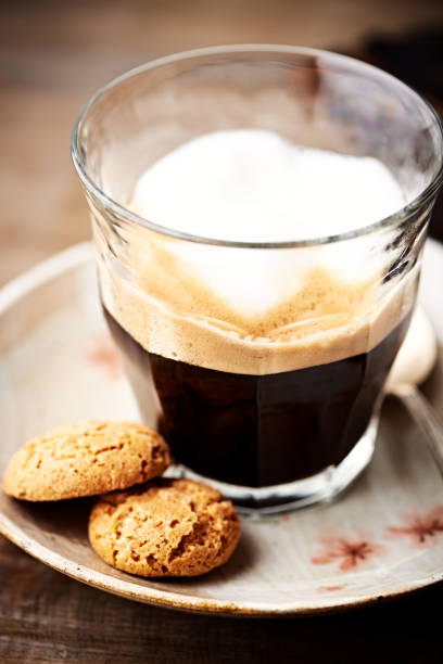 istock Glass of latte coffee with biscotti 947601294