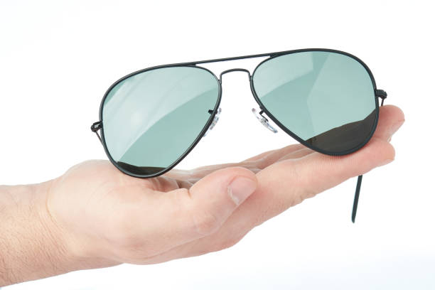 istock Sunglasses lay on hand palm 947607688