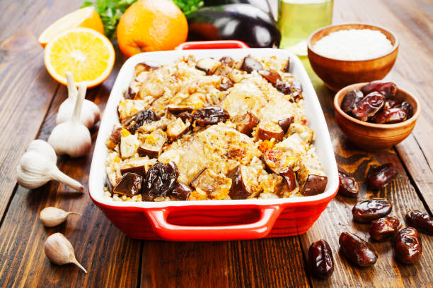 istock Chicken thigh baked with rice, eggplant and figs 947623124