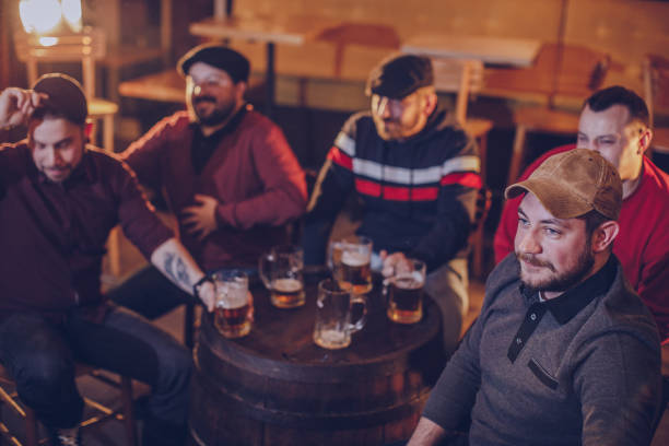 istock Friends relaxing in pub 947632788