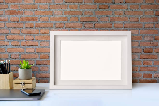 istock Mock up poster on desk. workspace concept 947633590