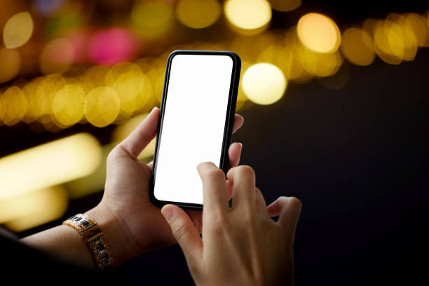 istock female hand with white screen mobile phone 947633652