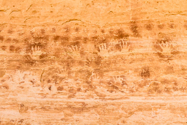 Handprint Pictographs at 17 Room Ruin Pictographs at 17 or 16 Room Ruin, an Ancestral Puebloan ruin in a north facing alcove along the San Juan River near Bluff, Utah. anasazi stock pictures, royalty-free photos & images