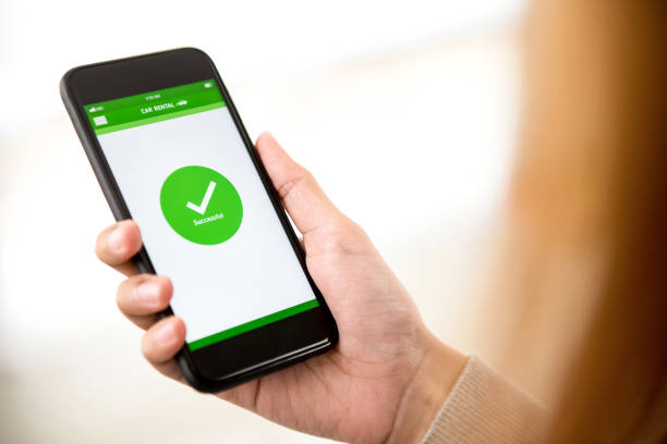 istock Successful online car booking payment confirmed on mobile phone screen 947648818