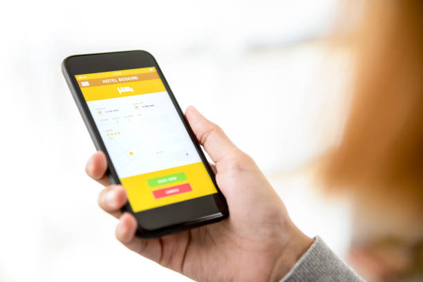 istock Woman using hotel booking application on smartphone 947648822