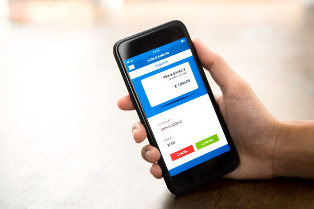istock Hand holding smartphone showing online electronic internet banking application on screen 947648840