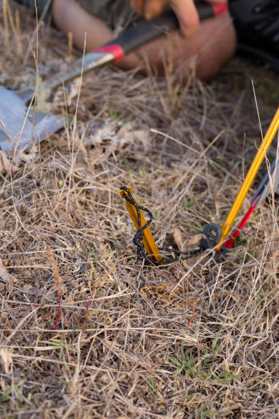 istock Camper places his tent peg into the hard soil 947655782