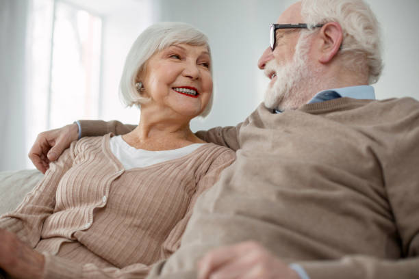 istock Happy elderly people looking at each other 947656432