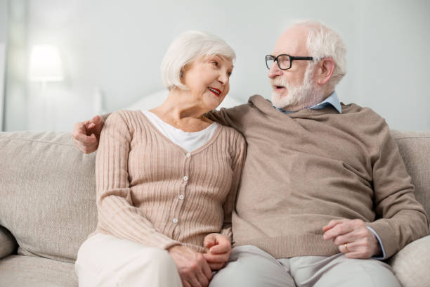 istock Positive aged man talking to his wife 947656536