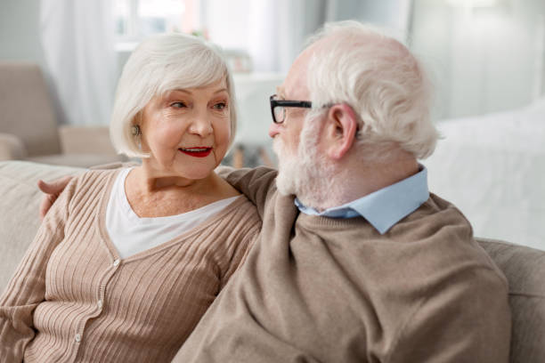 istock Nice aged man looking at his wife 947656594