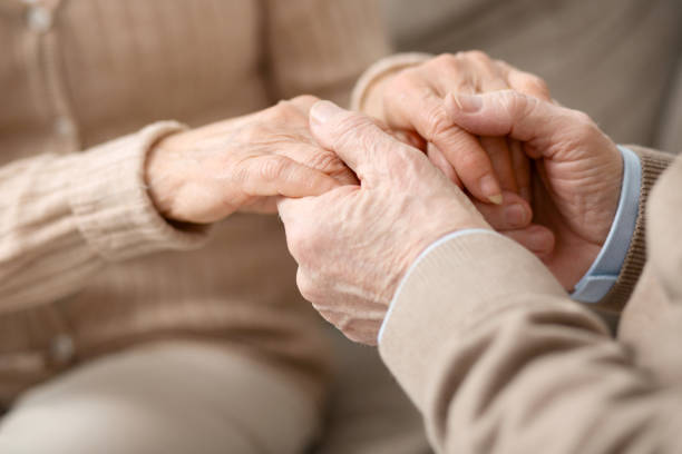istock Hands of pleasant aged couple 947659702