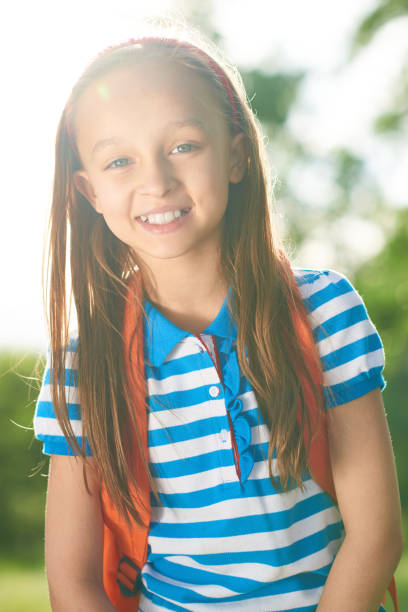 istock Positive attractive schoolgirl 947660438