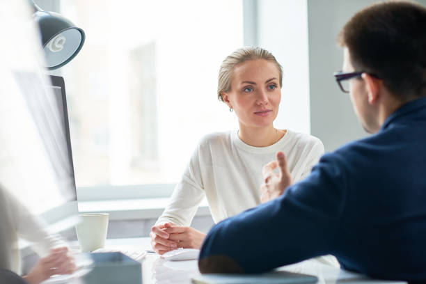 istock Pensive lady listening to colleagues offer 947663718
