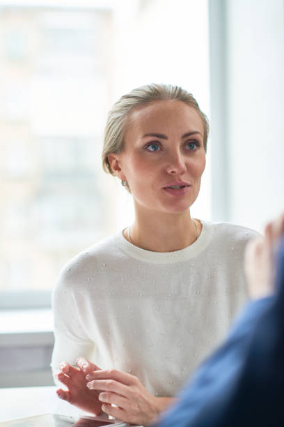 istock Confident pretty lady leading communication with business partner 947663726
