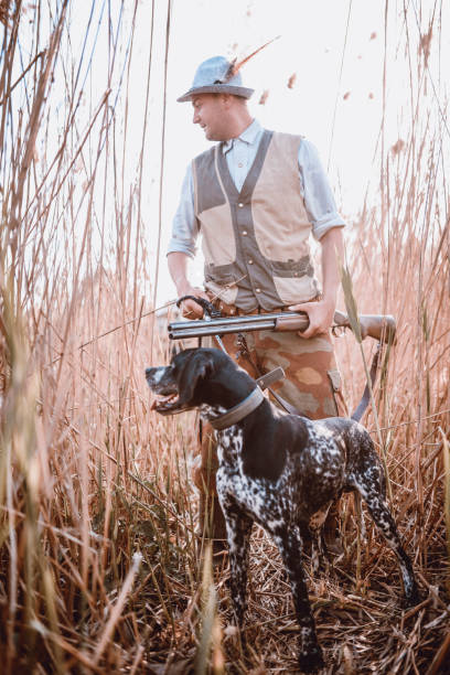 istock Hunter and His Dog in Action 947663928