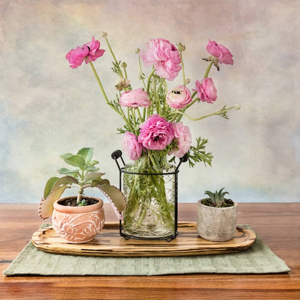 A table centerpiece of Ranunculus flowers
