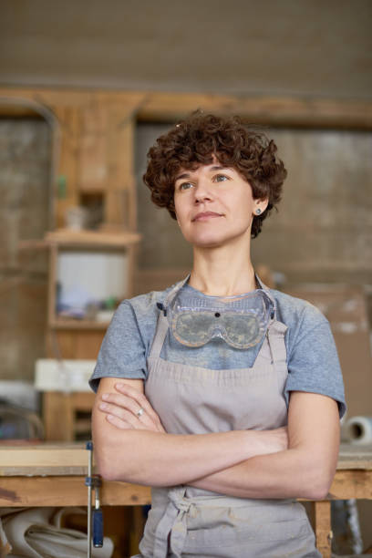 istock Confident craftswoman contemplating in workshop 947668270