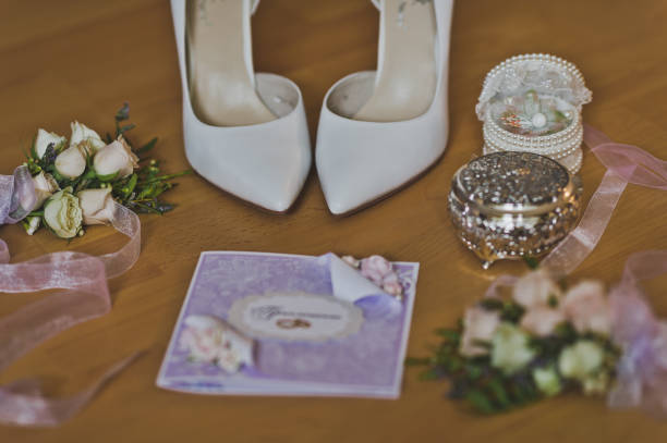 istock Accessories of the bride at the wedding table 556. 947680022
