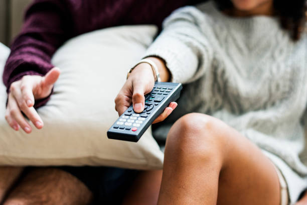 istock Couple watching a tv show together 947682802