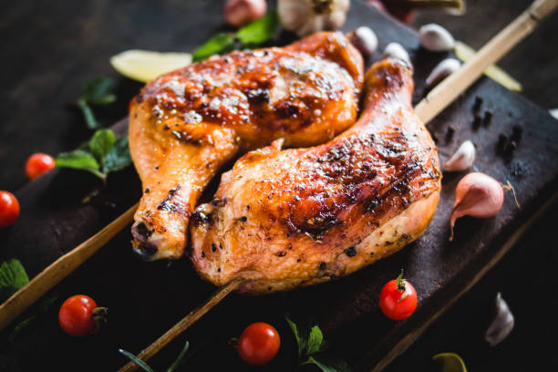 istock Chicken Hips Garlic pepper grilled Placed on a wood chopping board 947683428
