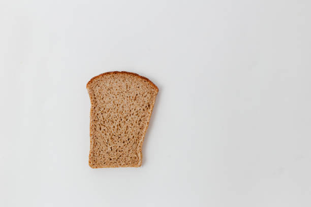 istock a slice of bread from the mixed flour on a white background 947685932