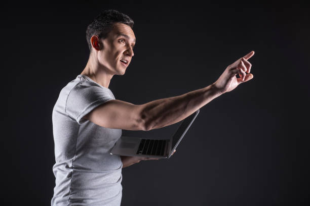 istock Delighted positive man stretching out his hand 947686300