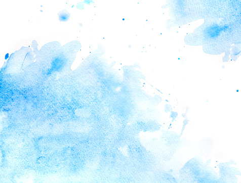 blue watercolor background with splashes on white watercolor paper. My own work.