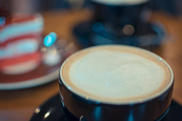 istock Hot Coffee in black cup on wood table 947694696