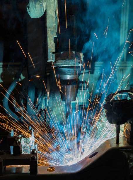 istock Industrial robot is welding automotive part 947698582