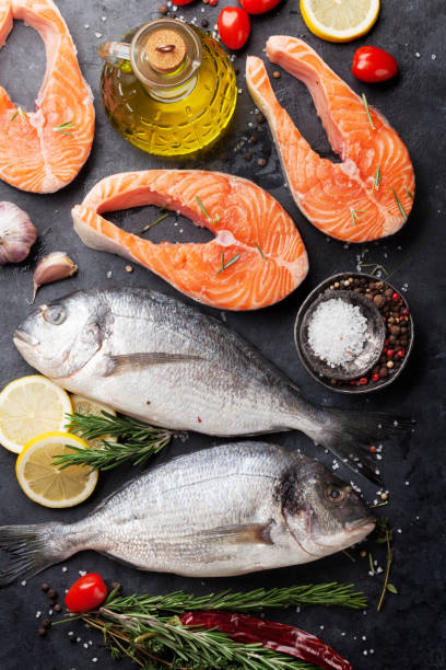 istock Raw salmon and dorado fish fillet 947703600
