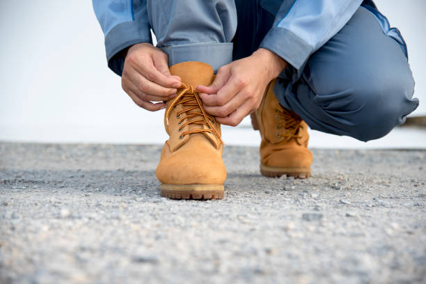 Workers wearing safety shoes at construction site